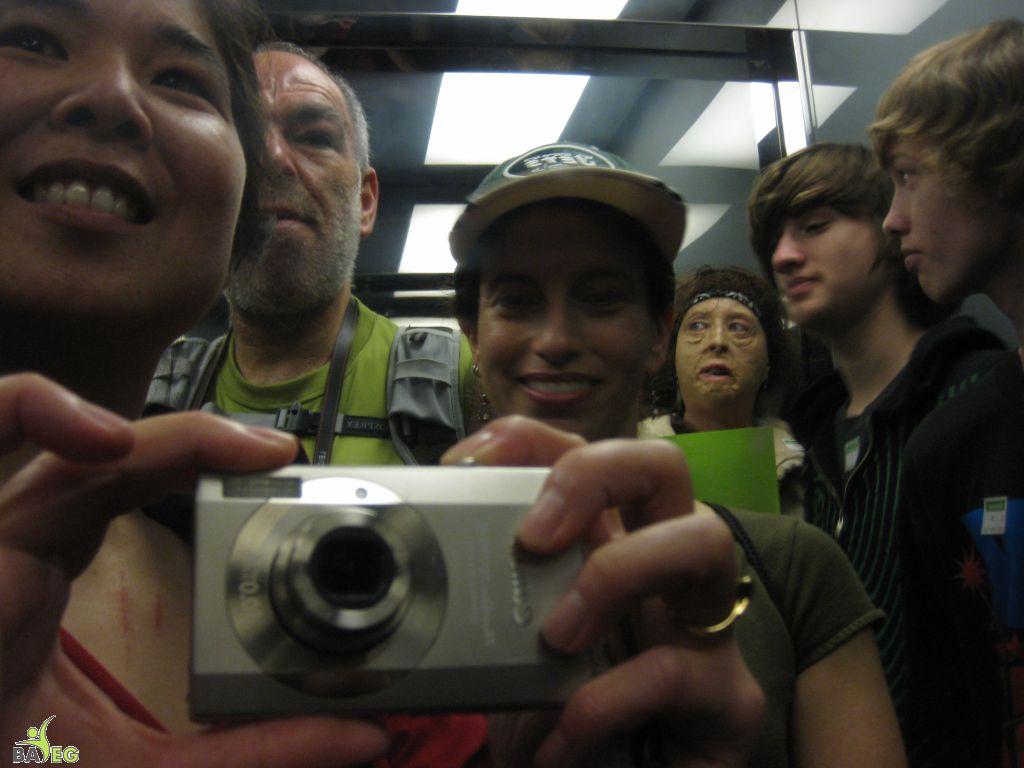 Self-photograph using the shiny interior of the elevator to the tower at Golden Gate Park