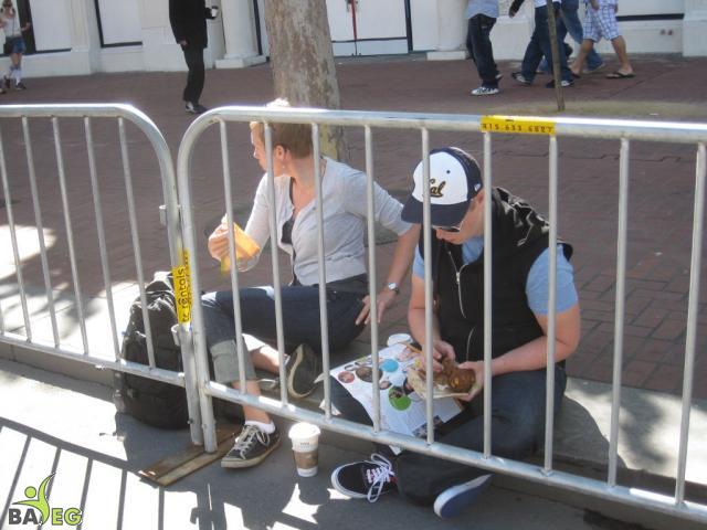 Waiting for the parade and reading a VSK from pre-parade leafleting by Ann, Katherine, Mila, Reeba and Tammy
