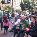 Waiting for the parade and reading a VSK from pre-parade leafleting by Ann, Katherine, Mila, Reeba and Tammy