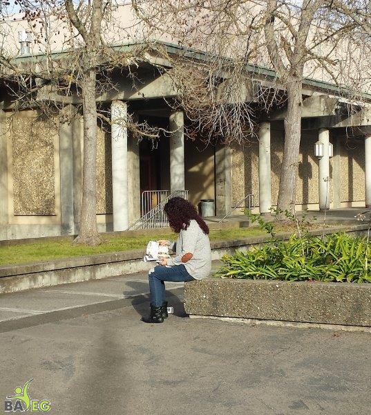 Student reading leaflet
