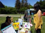 NVC - Quizmaster Mila talking to student organizer