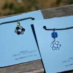 Glass beads pendant hangs from a cotton cord with silver color lobster clasp