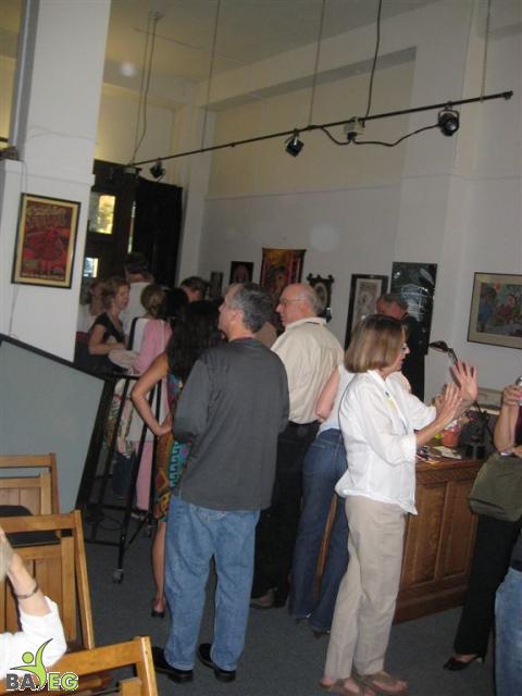 On the right, Kim talks to a guest